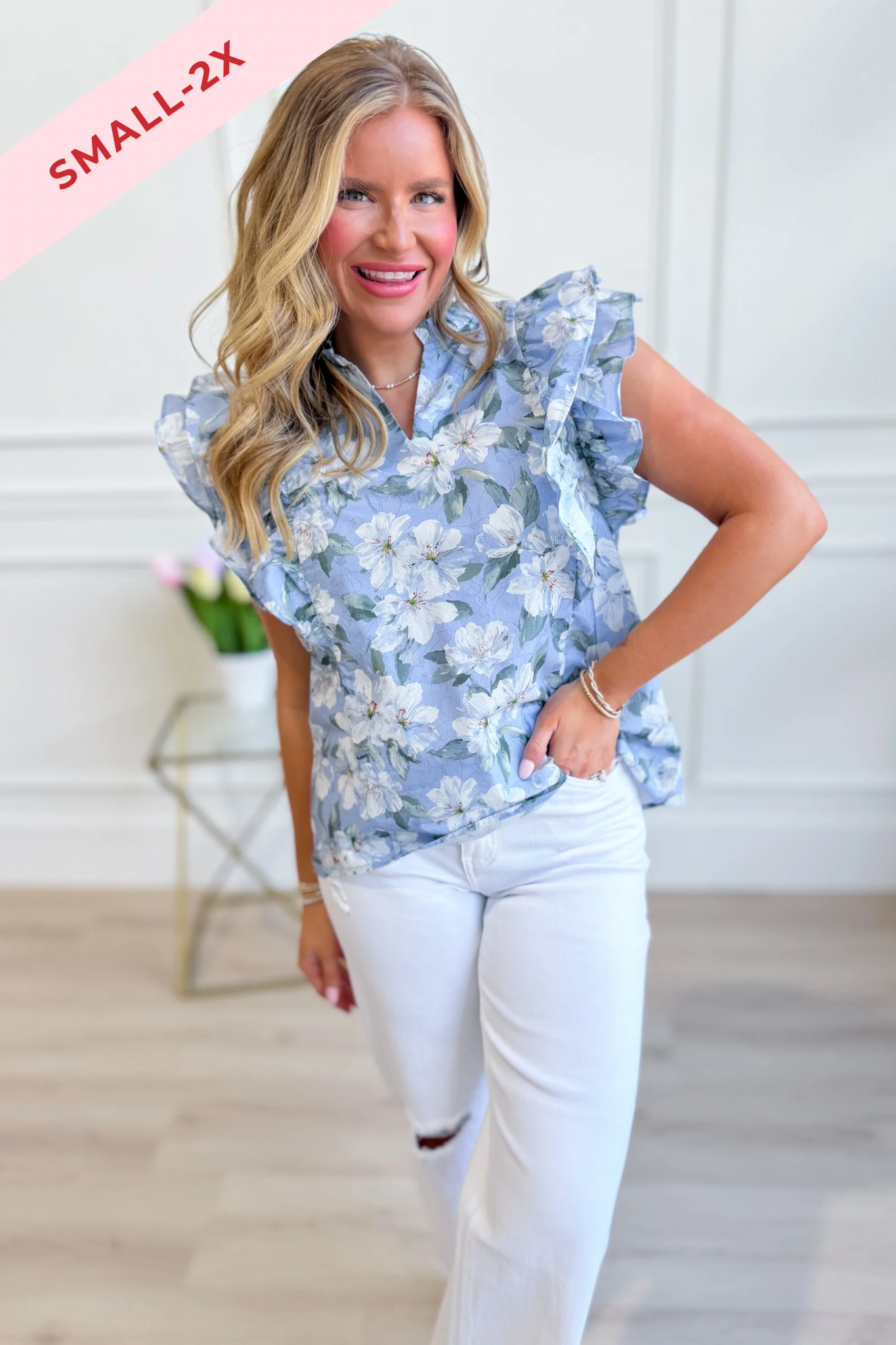 SHE + SKY Lori printed top with ruffle sleeves from 131 Spring Sweaters collection, featuring colorful floral design.