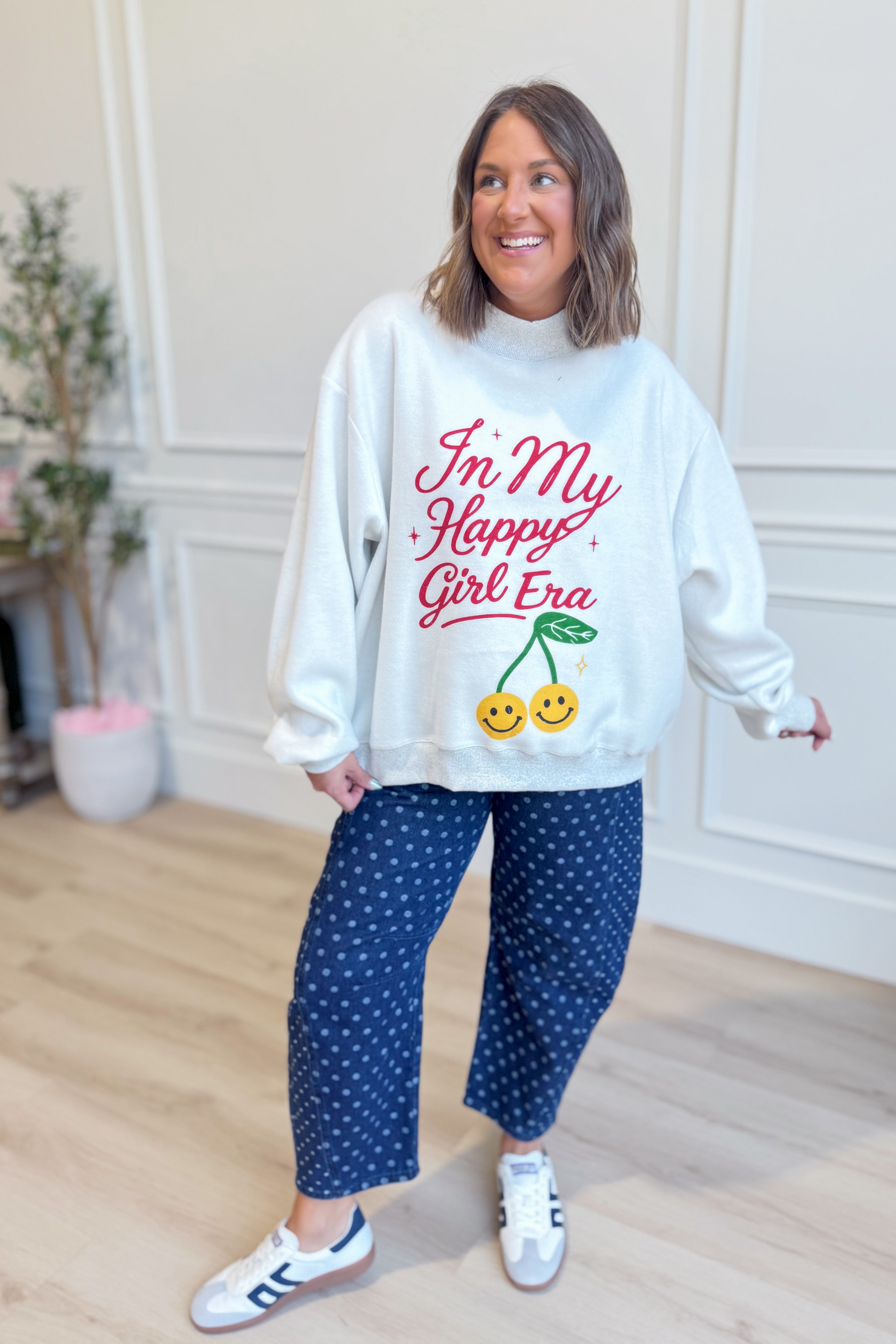 Reversible "In My Happy Girl Era" graphic sweatshirt by BUCKET LIST, featuring vibrant colors and cozy fabric.
