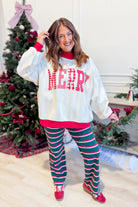 Reversible red and striped Merry and Graphic Sweatshirt by PEACH LOVE featuring festive holiday design and comfortable fit.