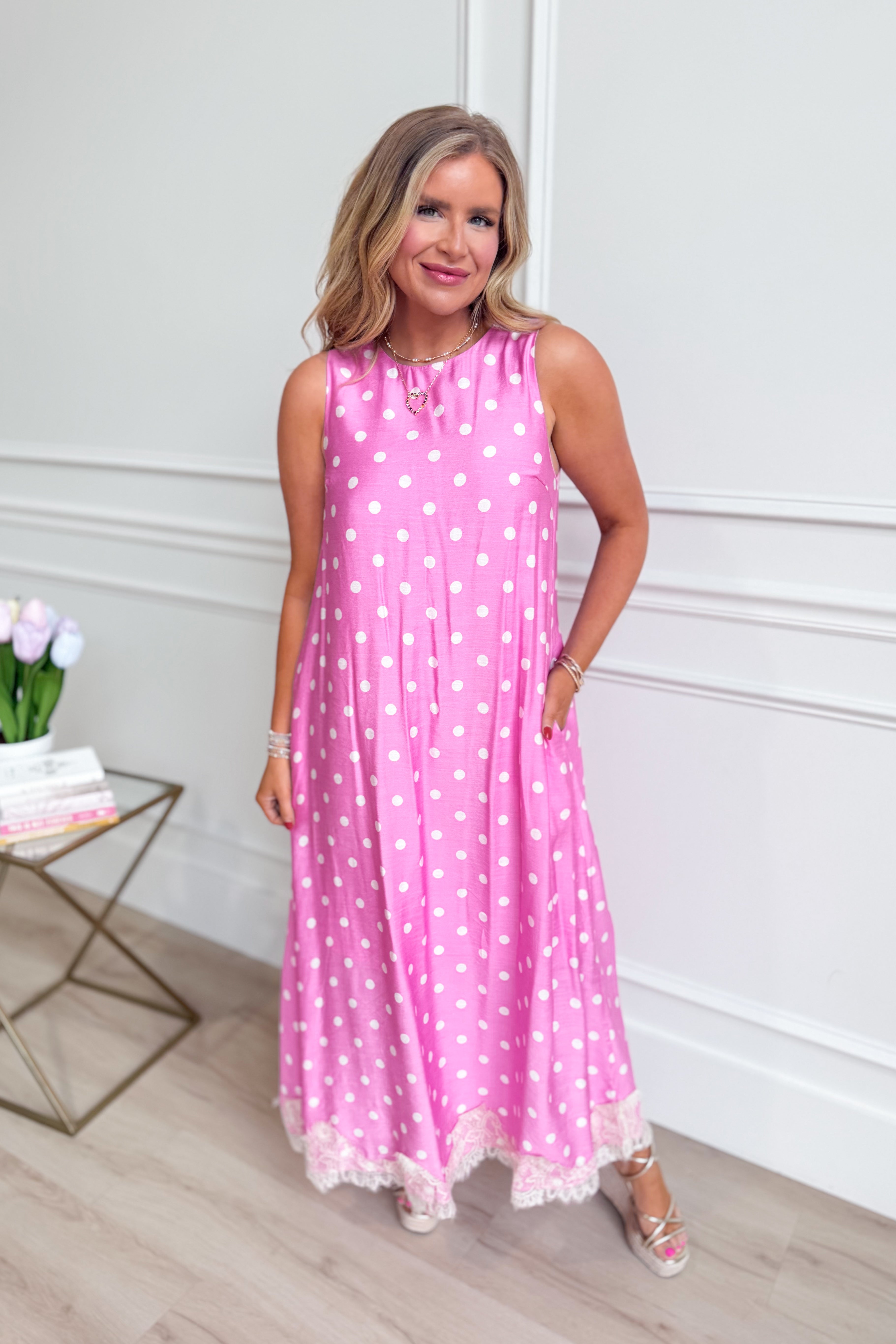ENTRO Carrie Polka Dot Midi Dress featuring a stylish, flowy silhouette with polka dot pattern and elegant design.