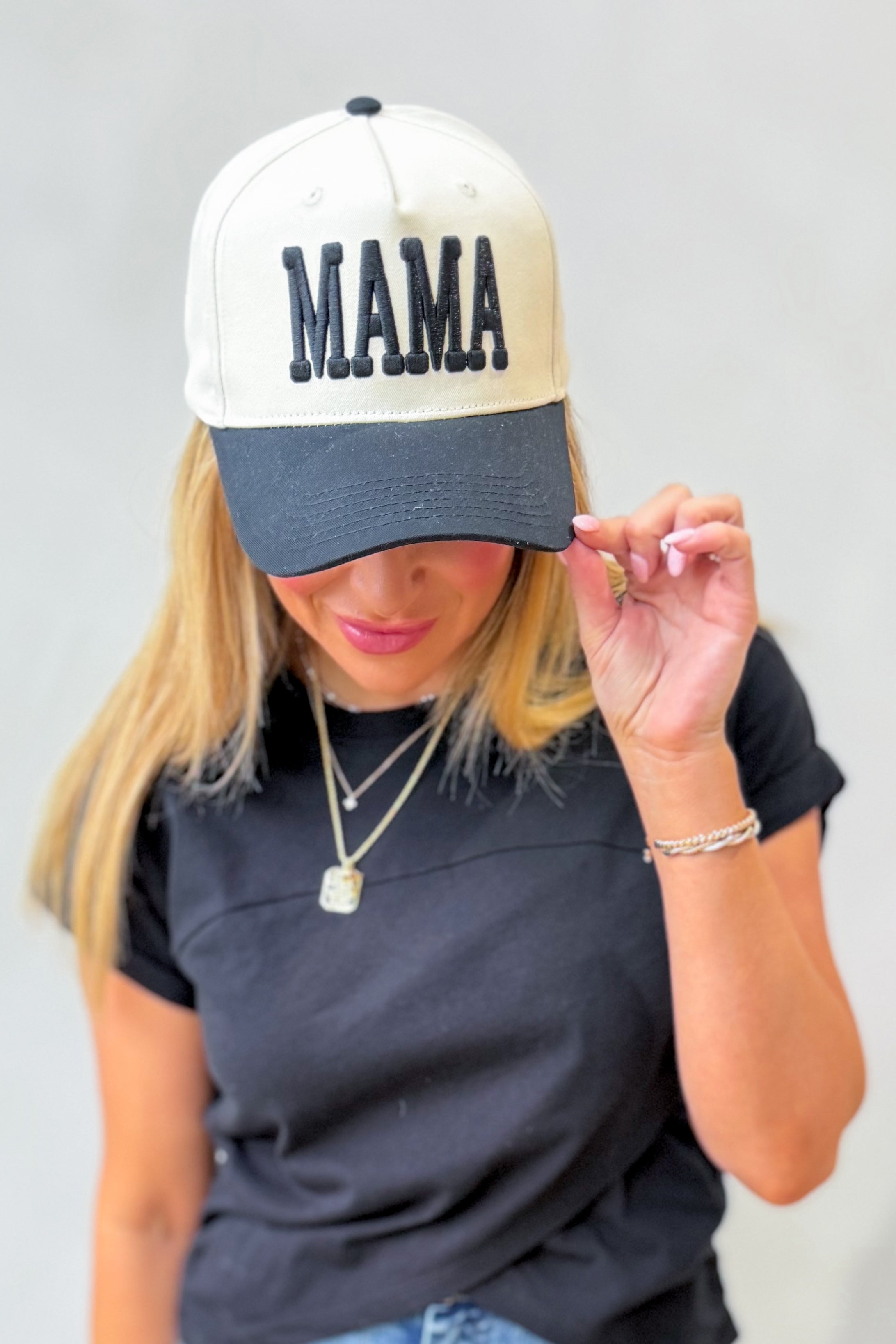 Mama Cream and Black Puff Trucker Hat by ETTA & EAST, featuring a cream front panel and black puffed mesh back.