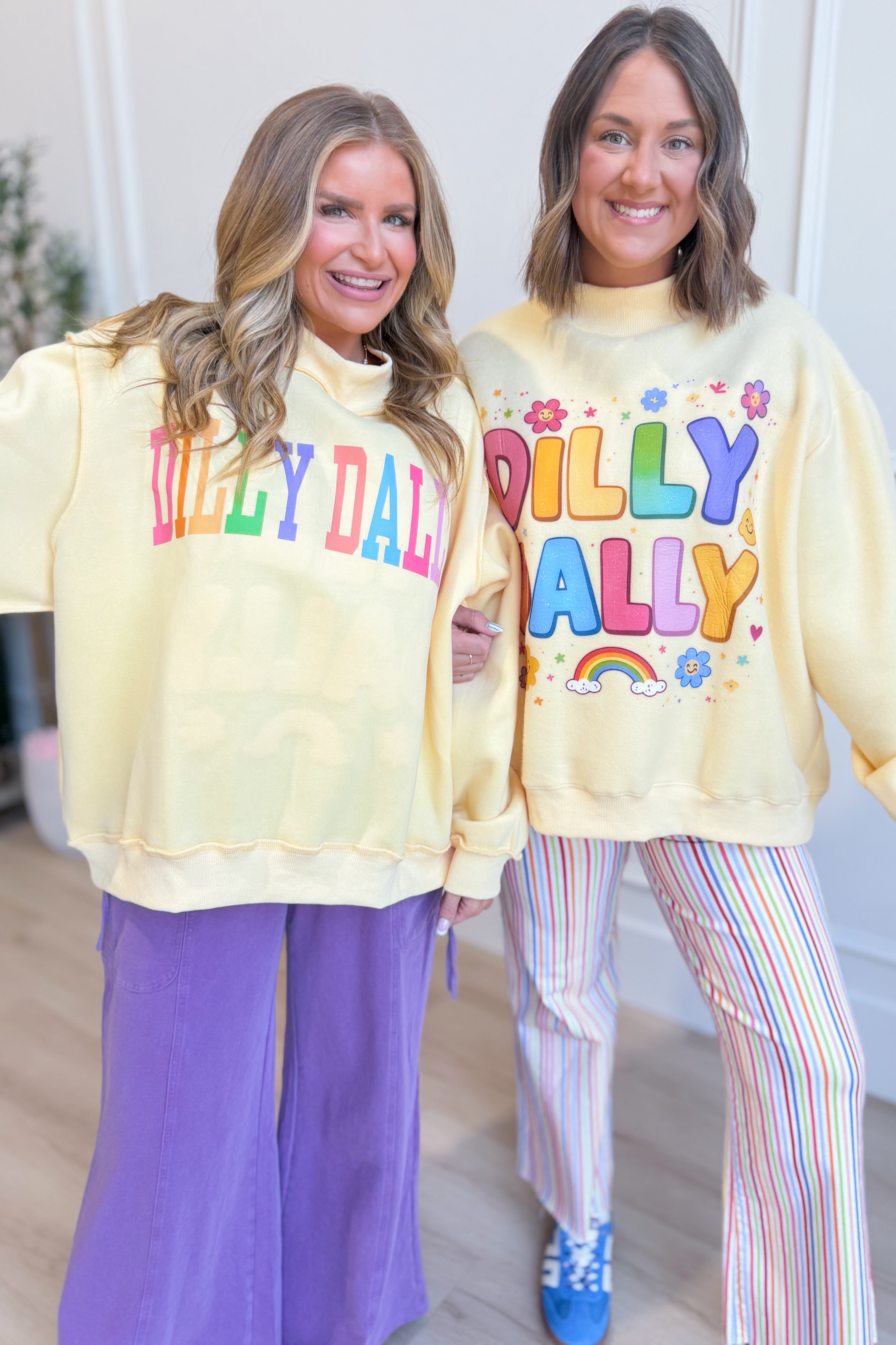 Reversible rainbow mock neck sweatshirt from BUCKET LIST's Dilly Dally 137 Graphic Sweatshirts collection, with colorful rainbow design.