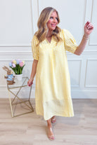 U MGEE USA Tonya plaid printed midi dress with long sleeves and a fitted waist, showcasing a stylish plaid pattern.