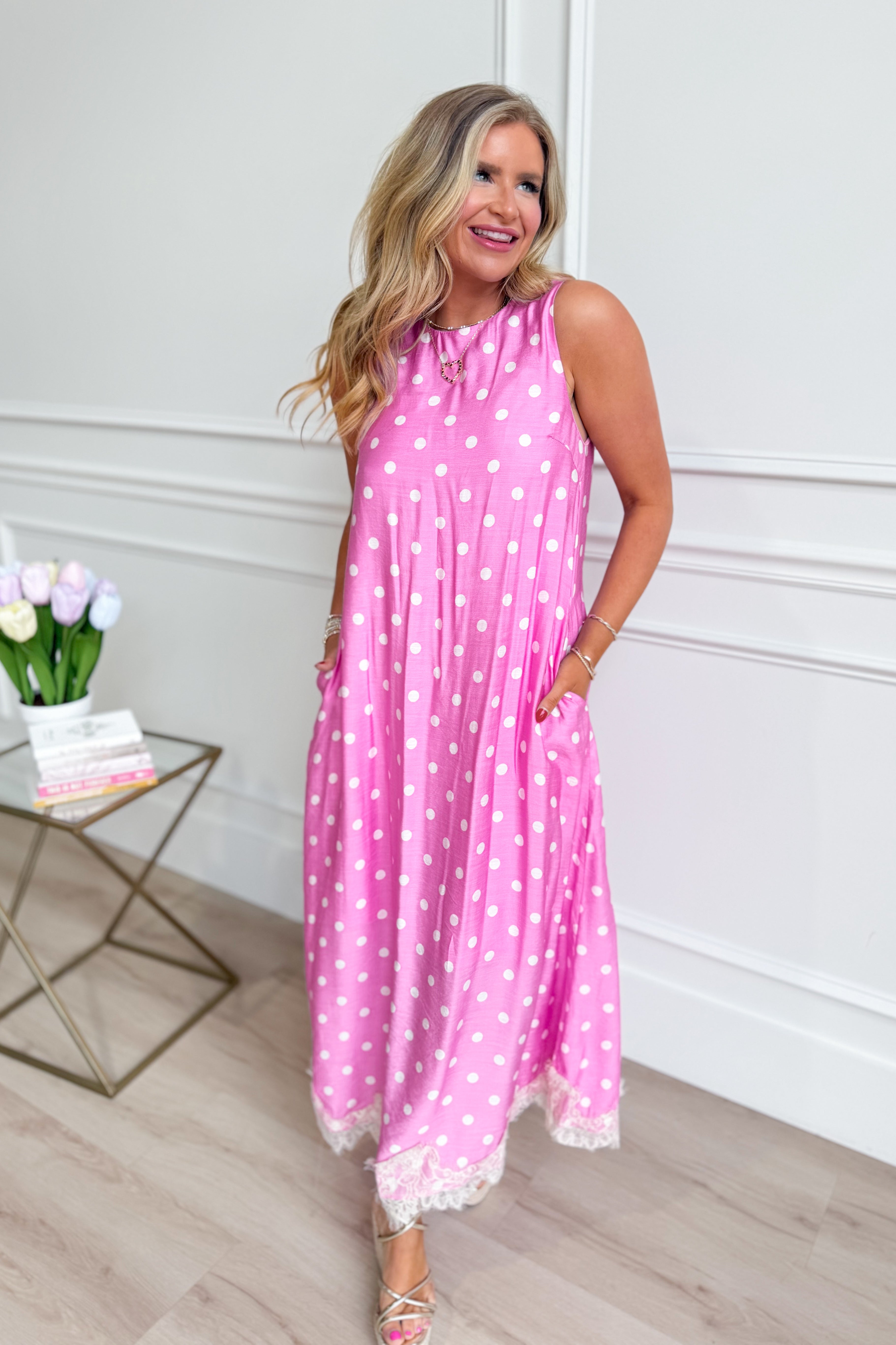 ENTRO Carrie polka dot midi dress with a fitted waist and flowing skirt, perfect for dressy occasions.