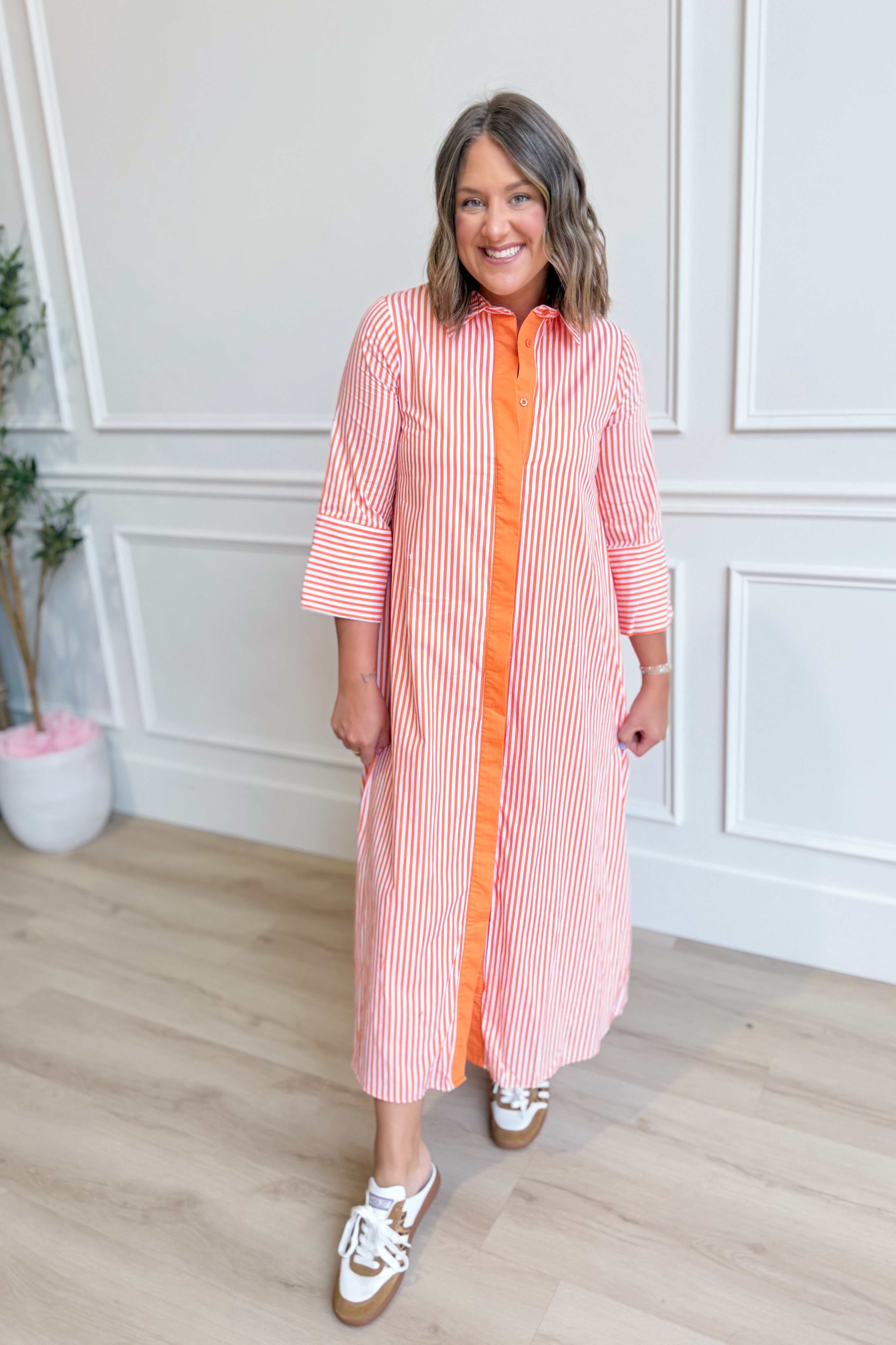TCEC Aly striped button-down midi dress with long sleeves and a fitted waist, featuring a classic mid-length design.