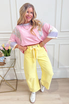 Candice Lt Yellow Mineral Washed Eyelet Barrel Jean from PEACH LOVE 147 Novelty Jeans, featuring a yellow mineral wash and eyelet details.
