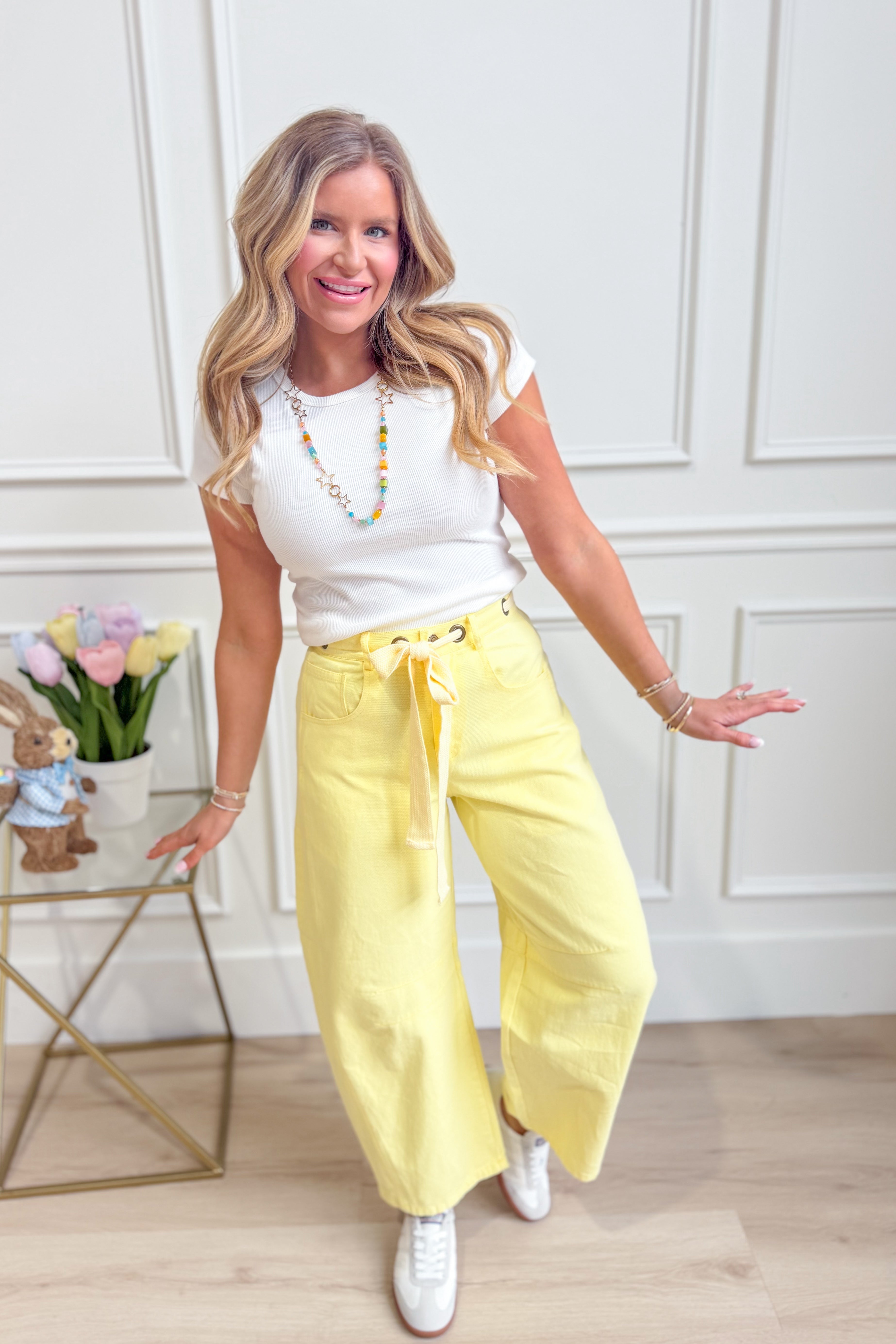 Light yellow PEACH LOVE Candice mineral washed eyelet barrel jeans with distressed details and classic fit.