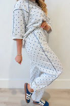 Frederick Grey Polka Dot French Terry Track Pants by PEACH LOVE, with elastic waistband and relaxed fit, shown in a casual setting.