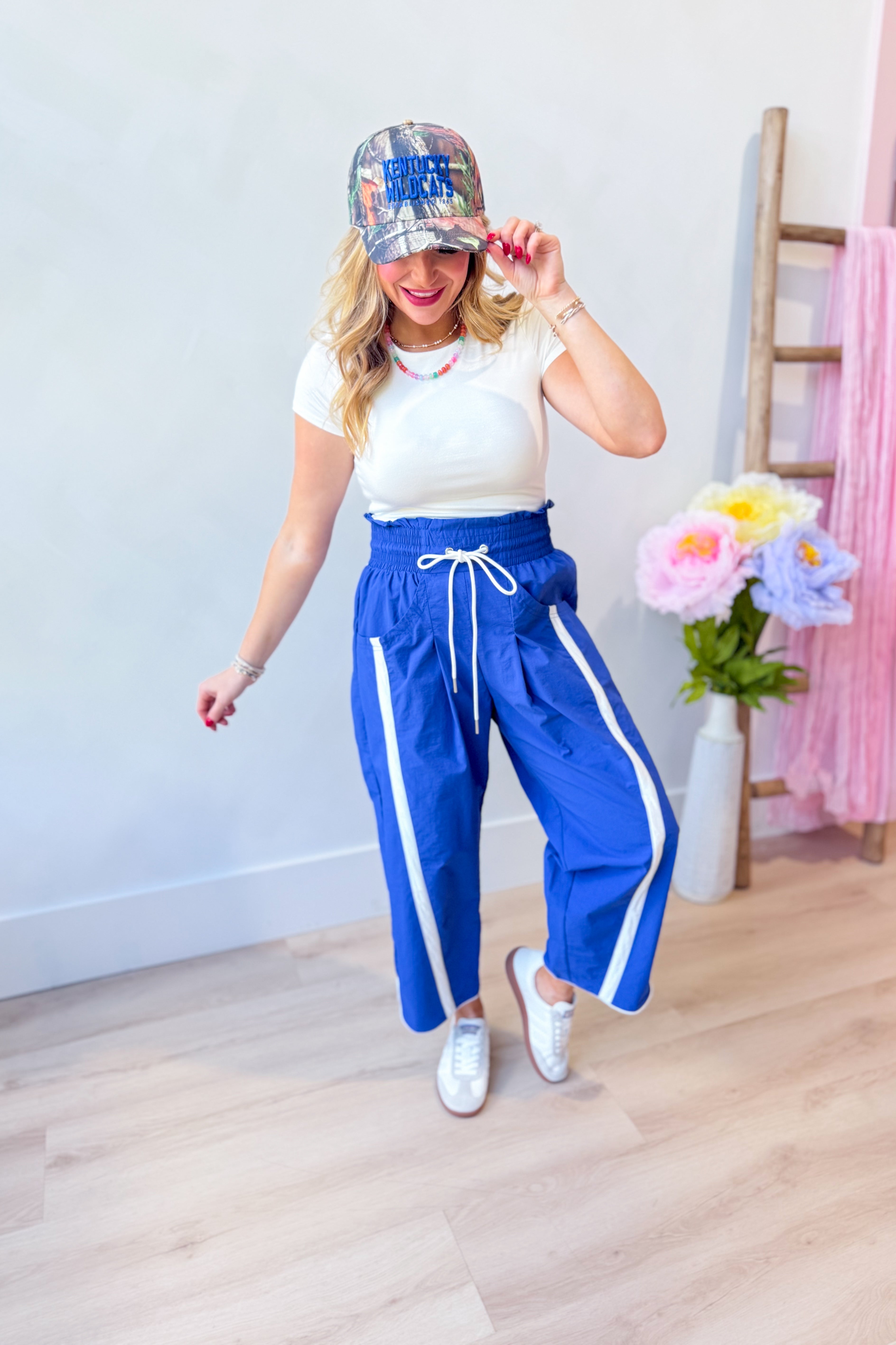 Lenny Blue BUCKET LIST windbreaker with contrasted stripe pant style, featuring lightweight fabric and stylish design.