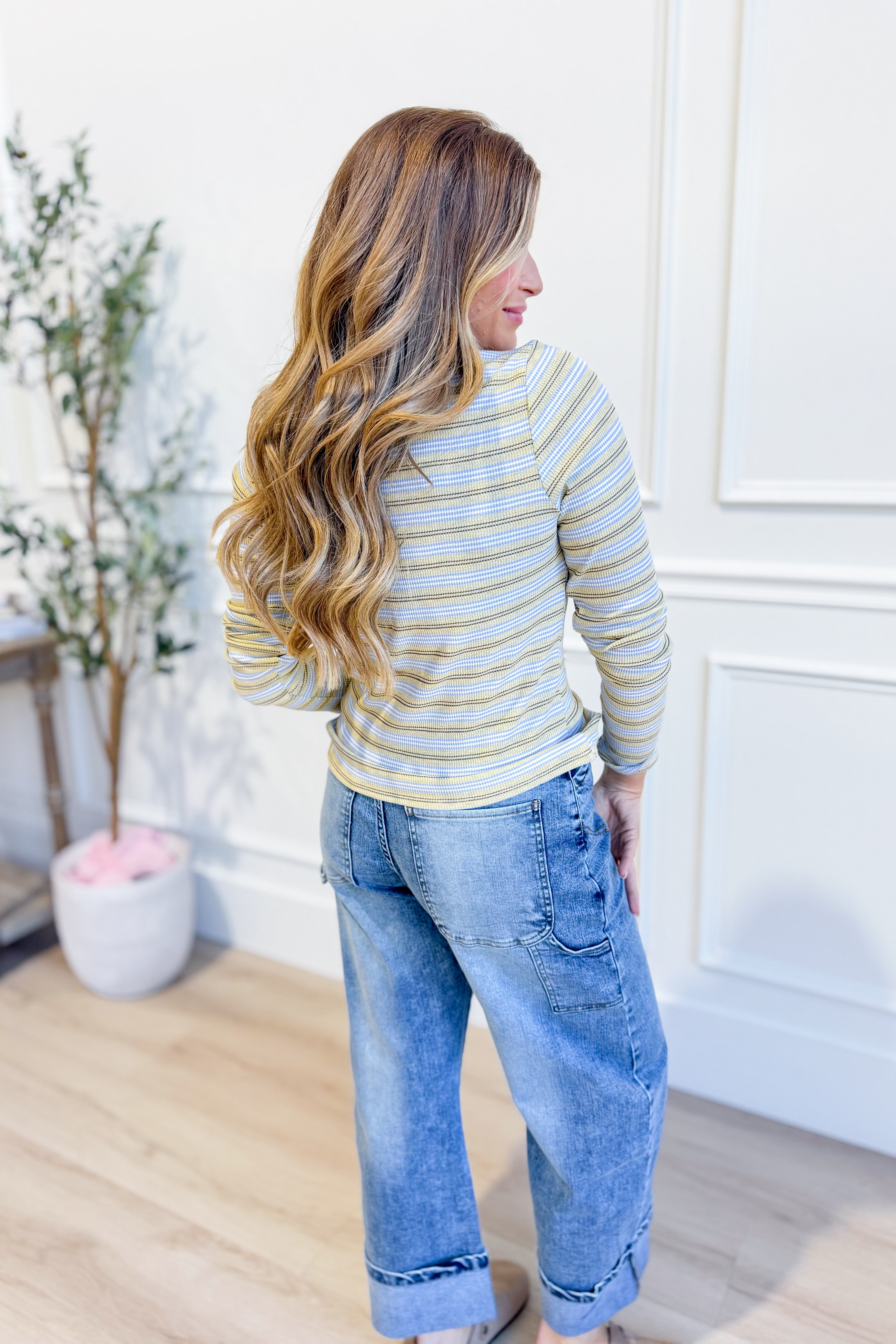 WISHLIST Kelly multi-striped long sleeve casual top with colorful horizontal stripes and a relaxed fit.
