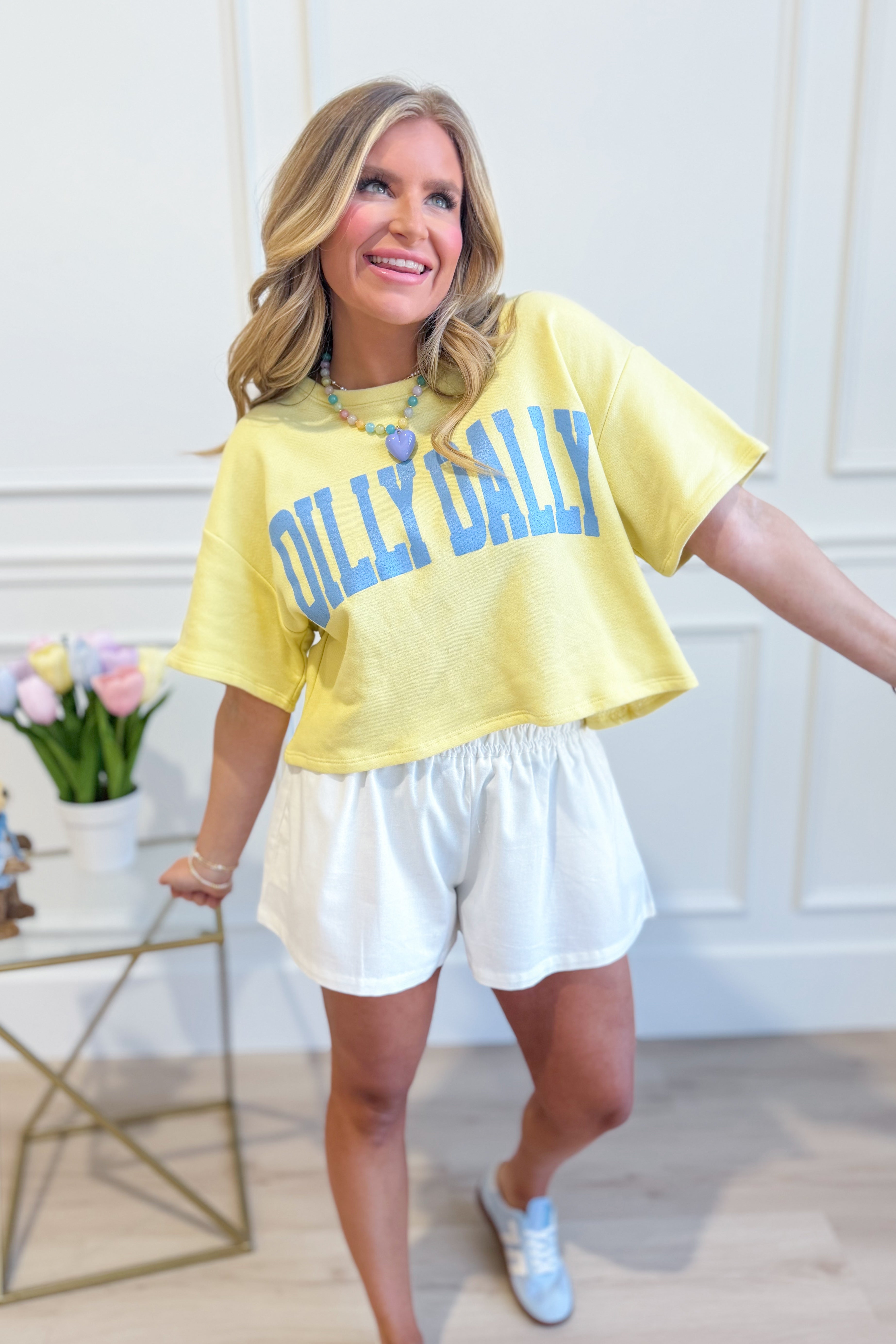 Dilly Dally graphic jersey crop top from BUCKET LIST, featuring bold 117 graphic tees design on soft fabric.