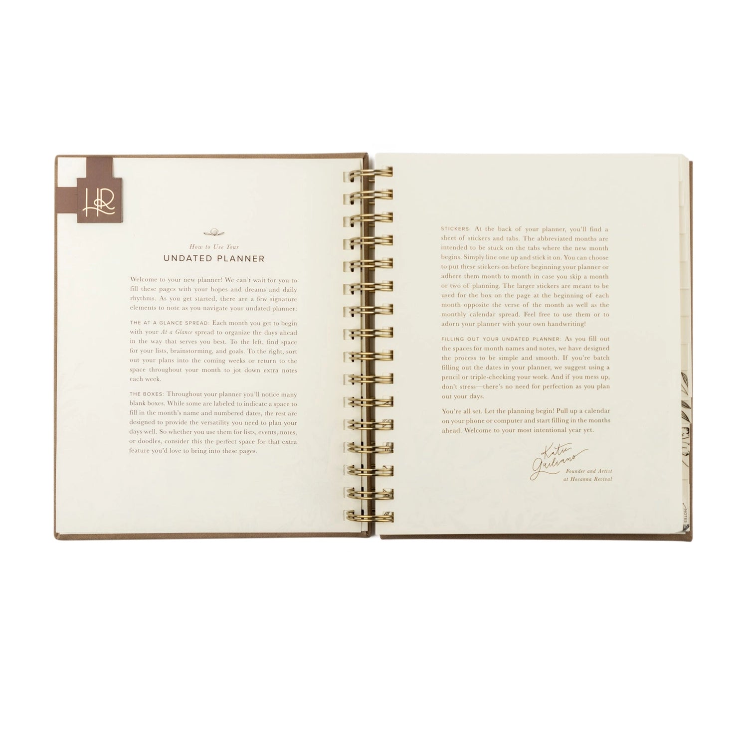 Undated 12-month planner by HOSANNA REVIVAL with a hardcover cover, designed for daily organization and scheduling.