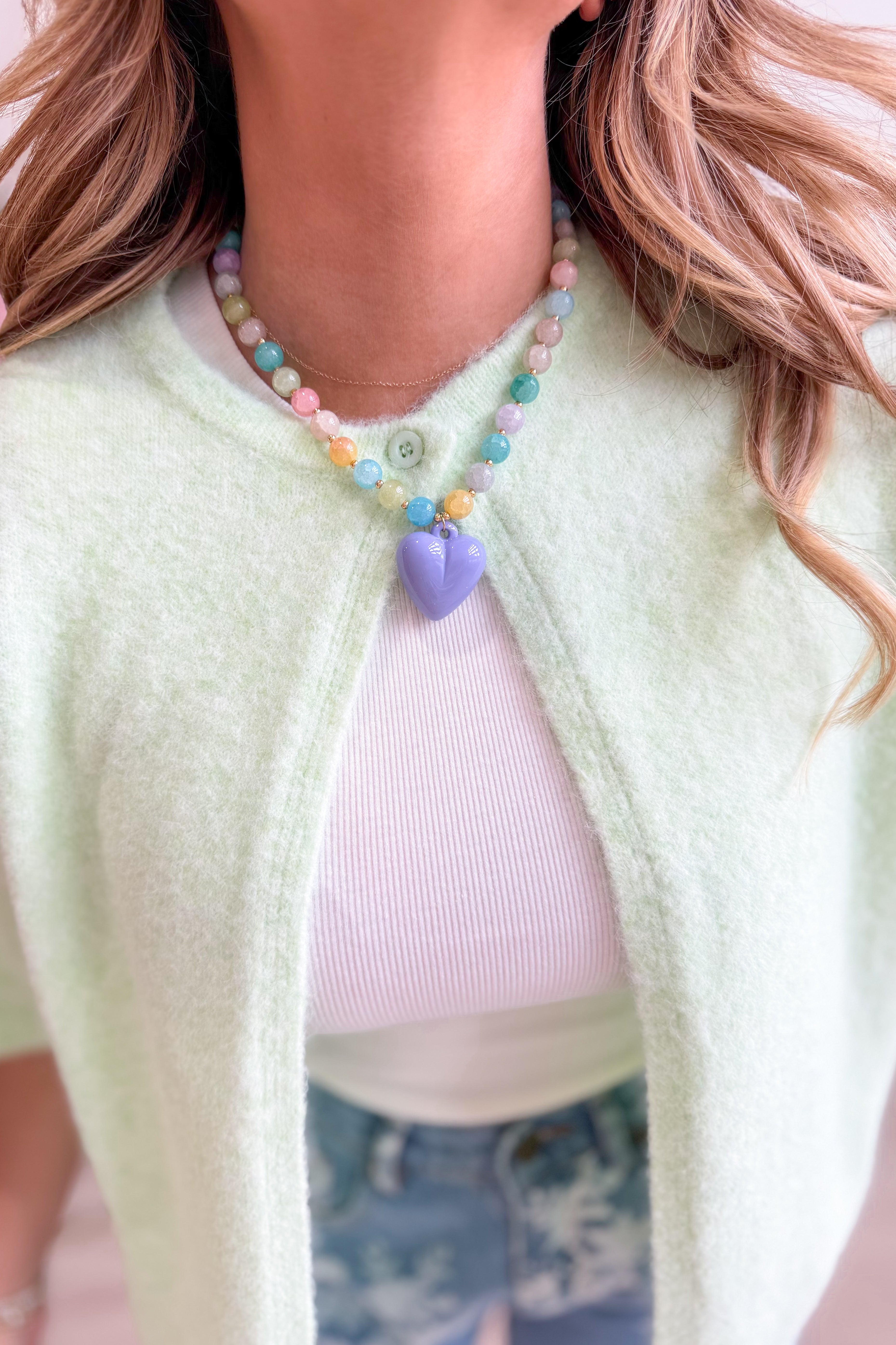 Colorful heart-shaped necklace from Treasure Jewels featuring lavender and vibrant hues, suitable for jewelry and accessory lovers.