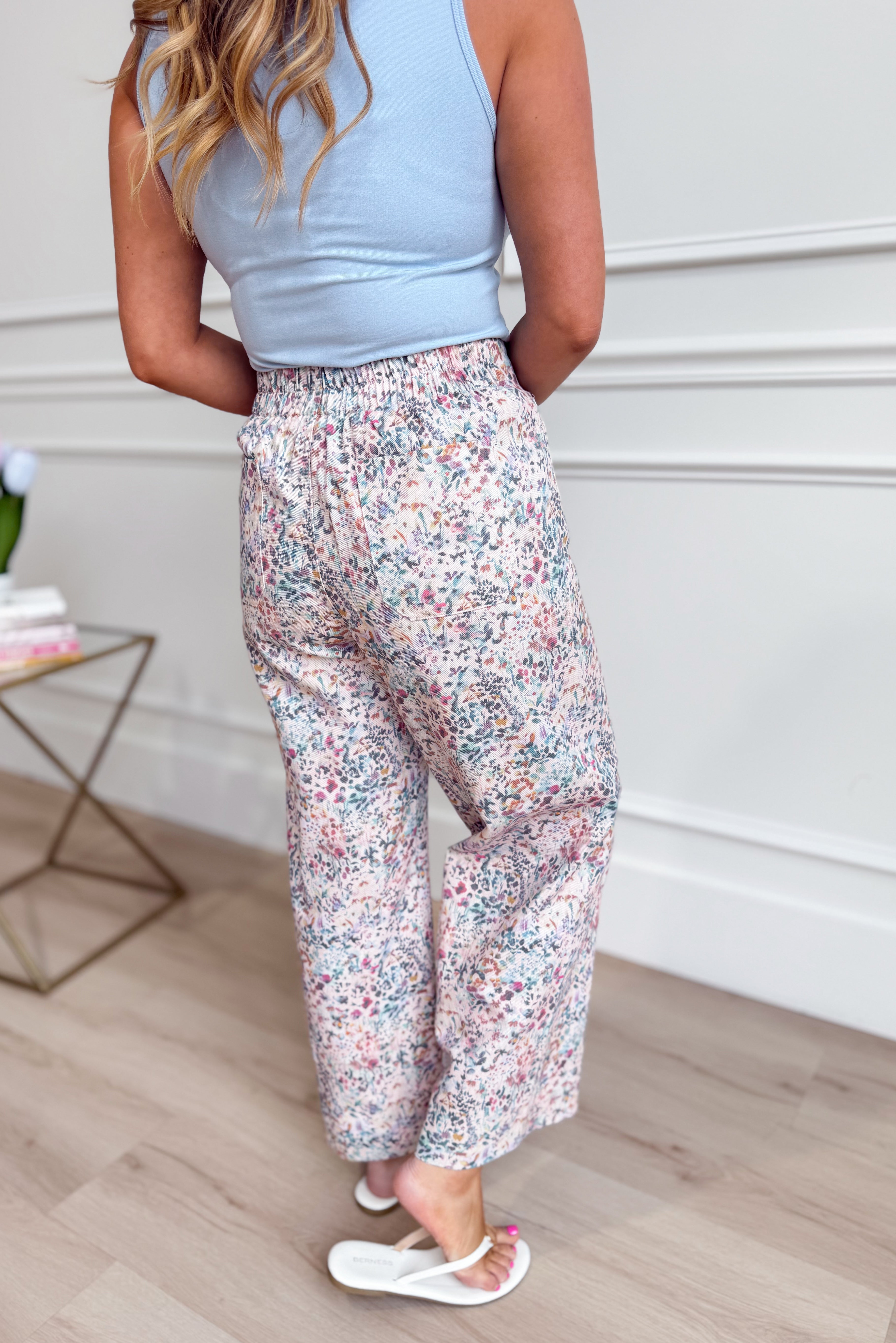 JODIFL Kona Blush Ditsy Floral Wide Leg Pants with high waist and flowing fabric, styled with a relaxed fit and floral print.