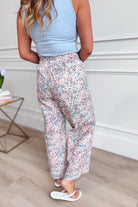JODIFL Kona Blush Ditsy Floral Wide Leg Pants with high waist and flowing fabric, styled with a relaxed fit and floral print.