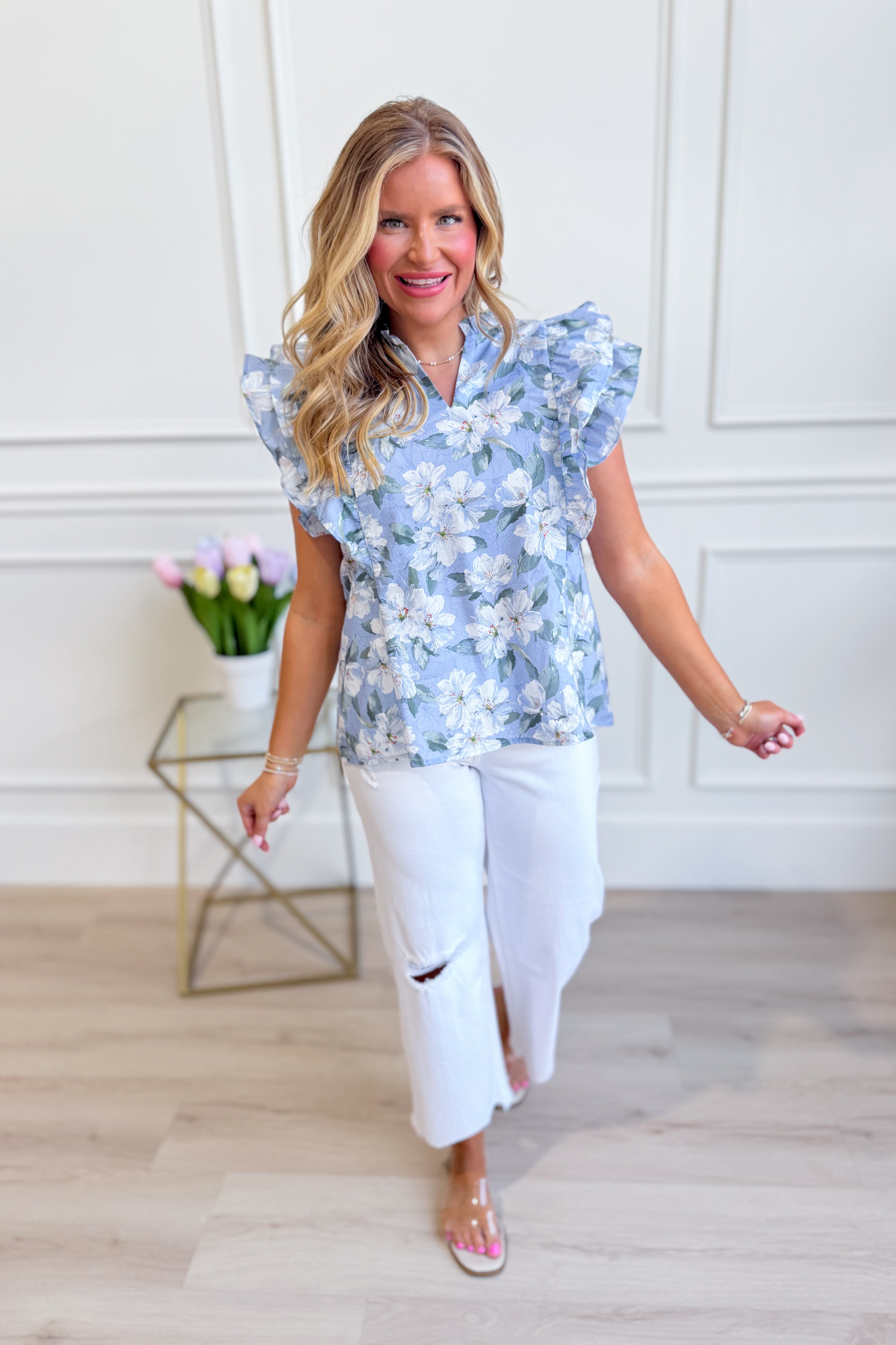 SHE + SKY Lori printed top with ruffle sleeves from the 131 Spring Sweaters collection, featuring a colorful floral pattern.