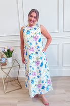 ENTRO Zoe blue botanical floral midi dress with a flowy silhouette and vibrant floral pattern, perfect for dressy occasions.