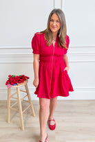 ENTRO Logan smocked waist zip-up dress in a stylish, fitted design with a high neckline and long sleeves, perfect for dressy occasions.