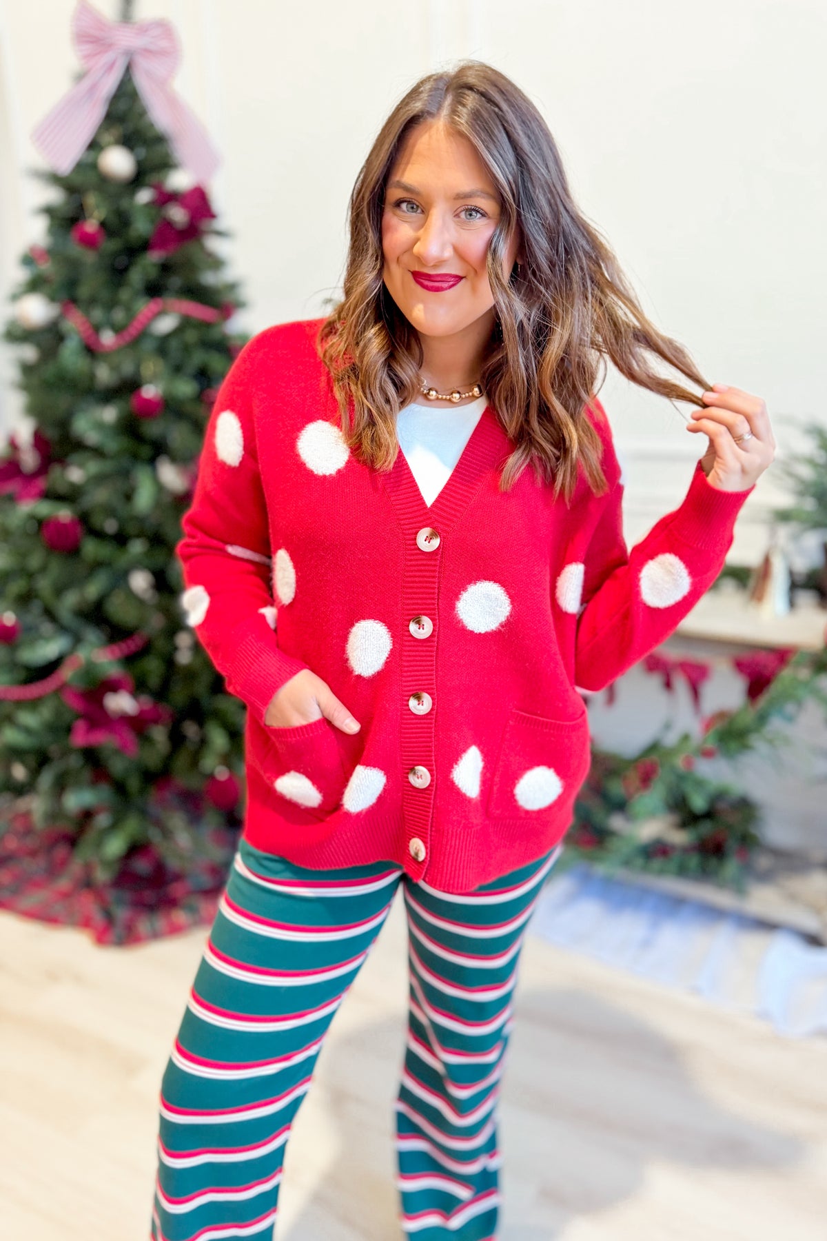 Red Saylor button-up cardigan from TWENTIFOURTH's 132 Fall Sweaters collection, featuring a classic knit design and front buttons.