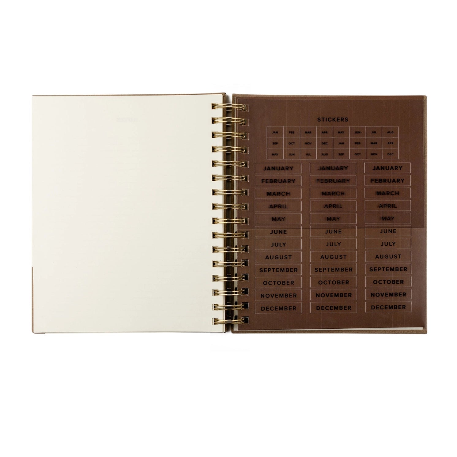Undated 12-month planner by HOSANNA REVIVAL with a stylish cover, designed for organizing schedules and dates efficiently.