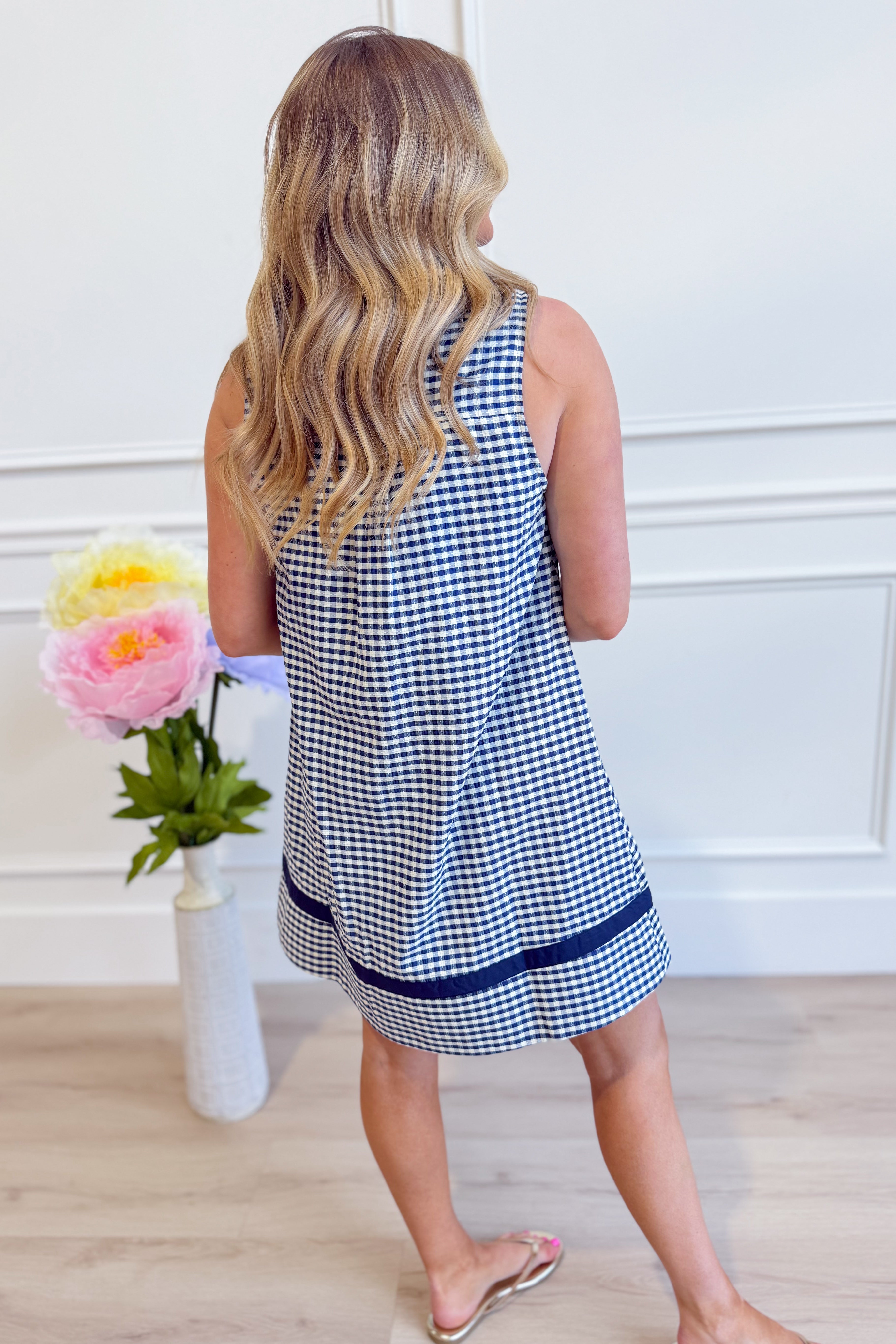 Corinne plaid sleeveless dress by ENTRO, featuring a stylish plaid pattern and elegant design, perfect for dressy occasions.