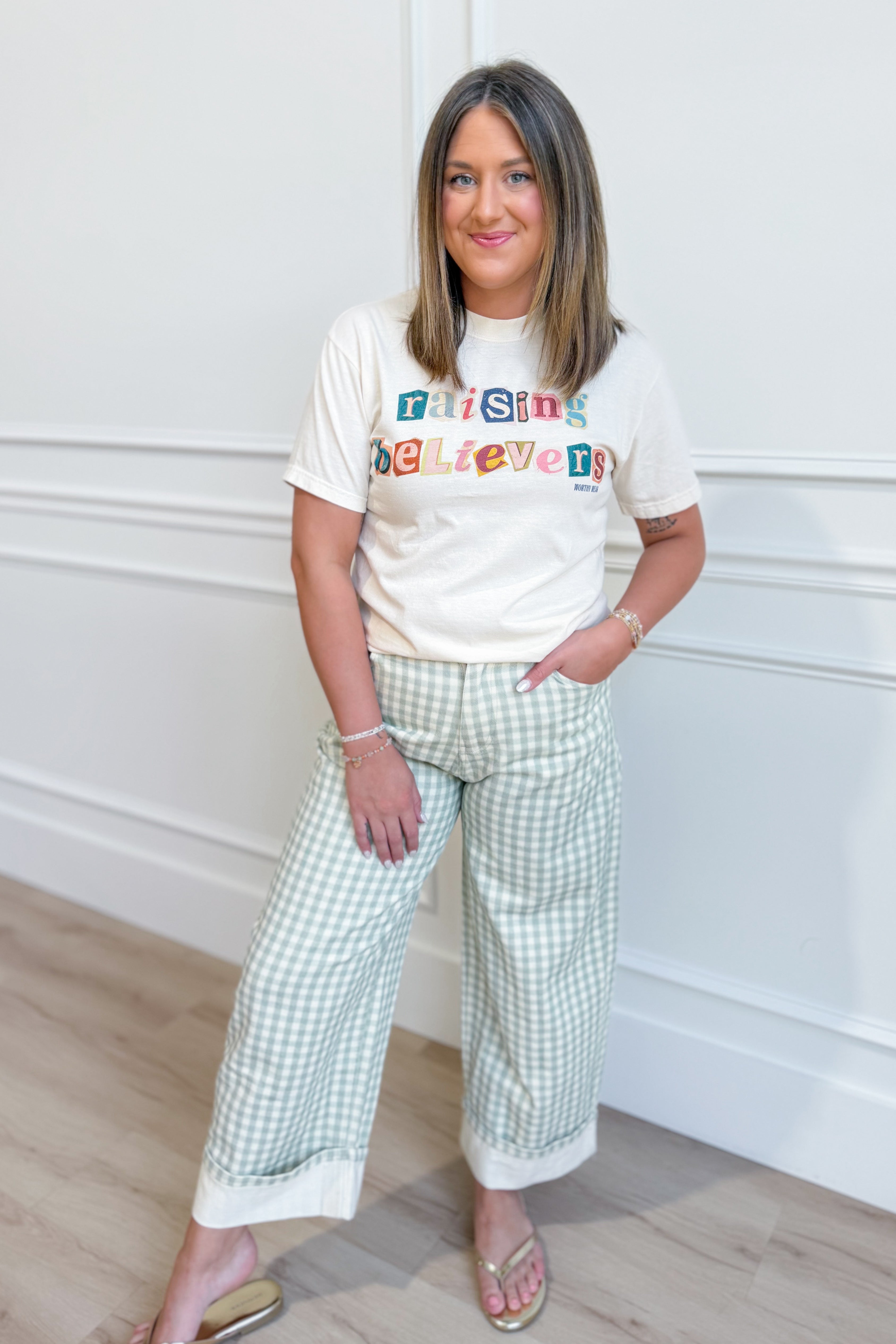 Raising Believers graphic T-shirt from Worthy Wear, featuring inspirational design on a casual 117 graphic tees style.