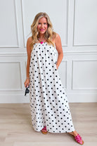 THINGS BETWEEN Laney polka dot maxi dress featuring a flowy silhouette and stylish pattern, perfect for dressy occasions.