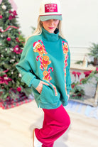 Ginger corduroy patch mock neck sweatshirt from PEACH LOVE, featuring graphic design and cozy, textured fabric.