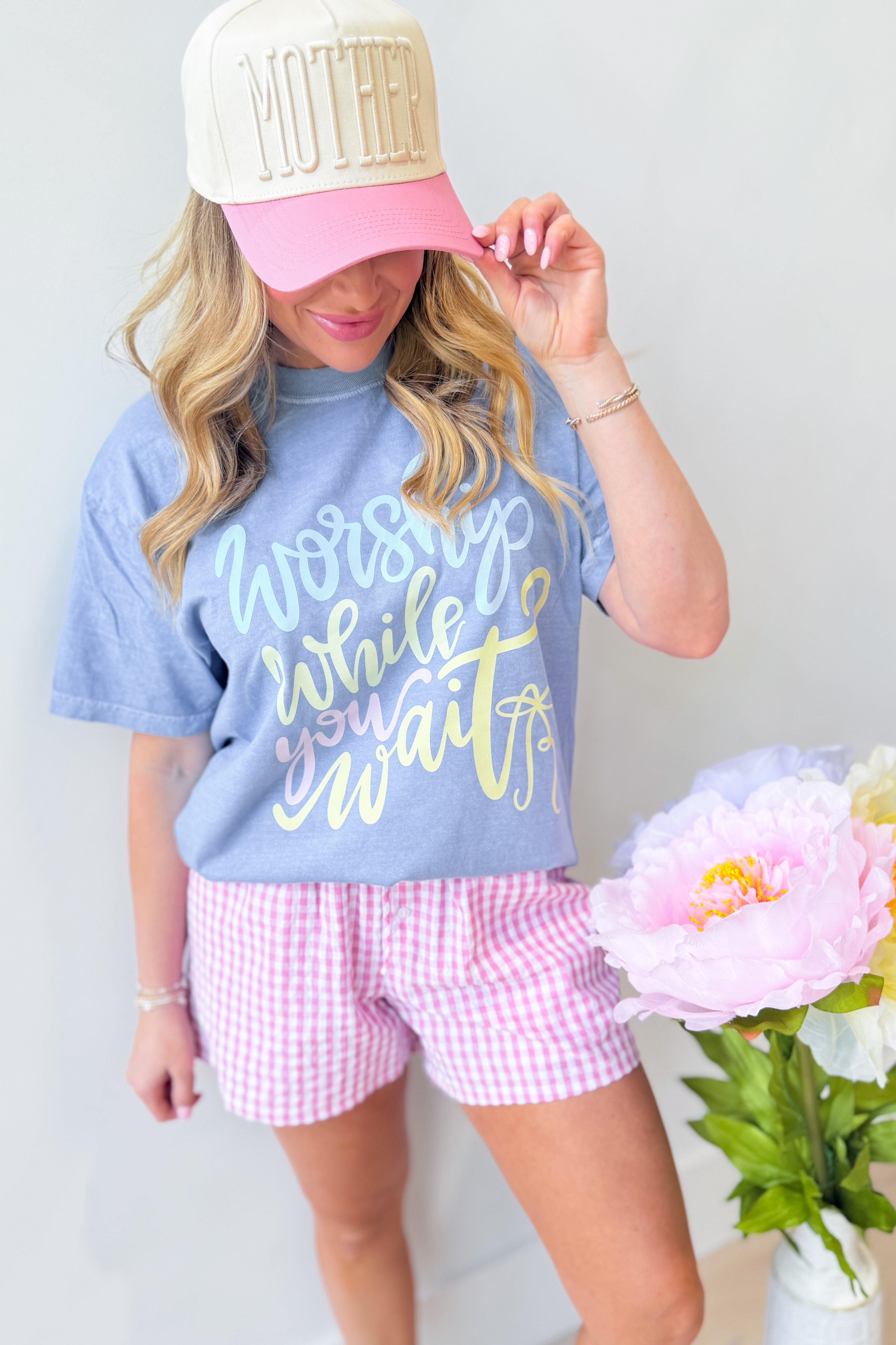 DASH FORWARD Worship While You Wait graphic T-shirt featuring bold text and modern design, casual fit, and comfortable fabric.