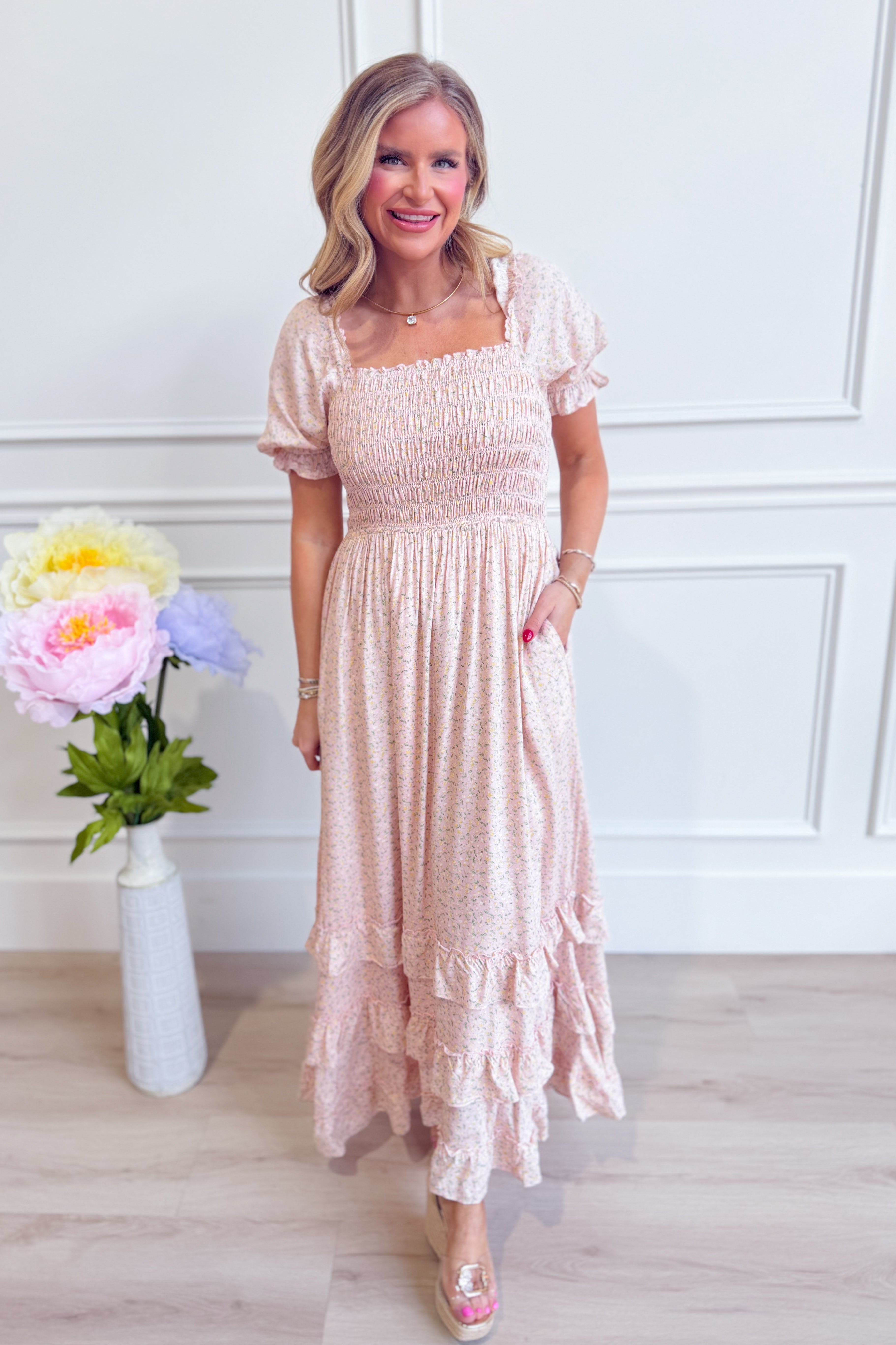 IN LOOM Luna smocked floral maxi dress featuring a flowy silhouette and colorful floral pattern on lightweight fabric.