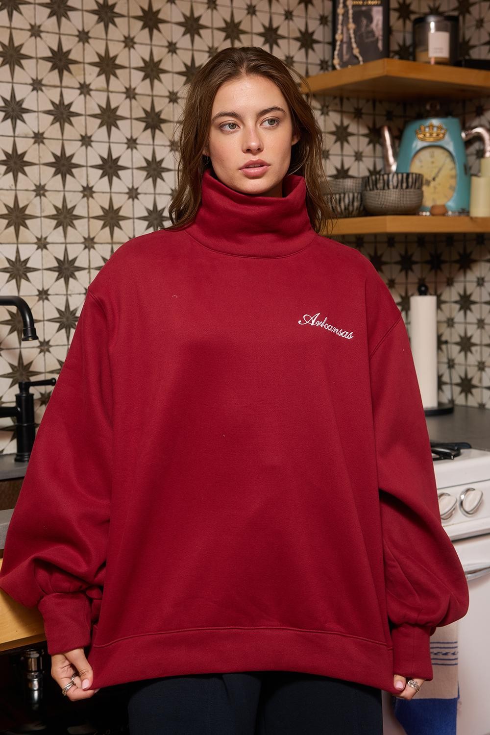 Crimson mock neck sweatshirt from BUCKET LIST's 137 Graphic Sweatshirts collection, rolled up to show soft fabric and stylish fit.