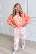 Smiley Jesus Loves You graphic sweatshirt by POPPY & PINE, featuring a cheerful smiley face and Christian message on a cozy 137 graphic sweatshirt.