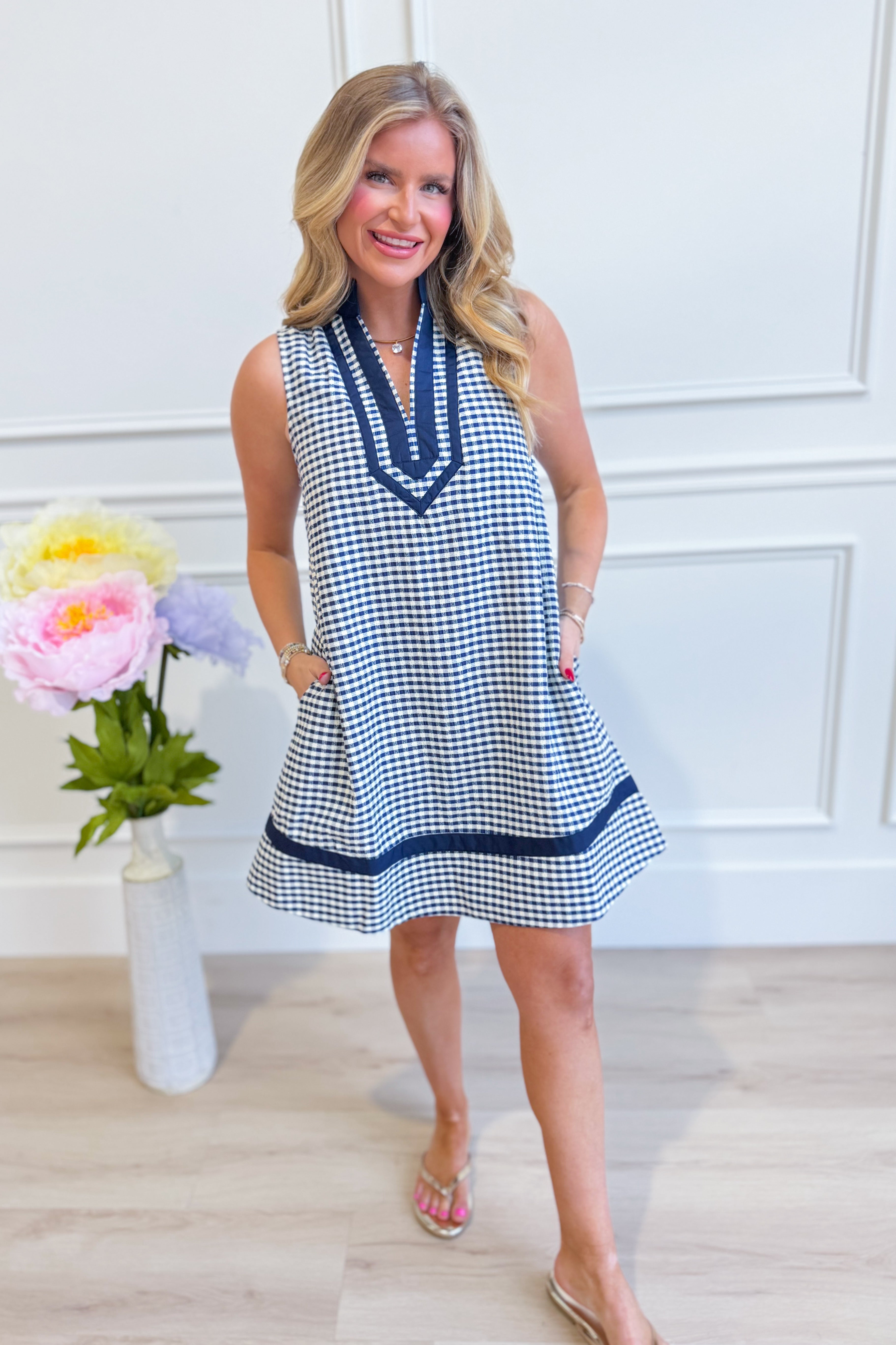 Corinne plaid sleeveless dress by ENTRO, stylish dressy dress with a classic plaid pattern and sleeveless design, perfect for elegant occasions.