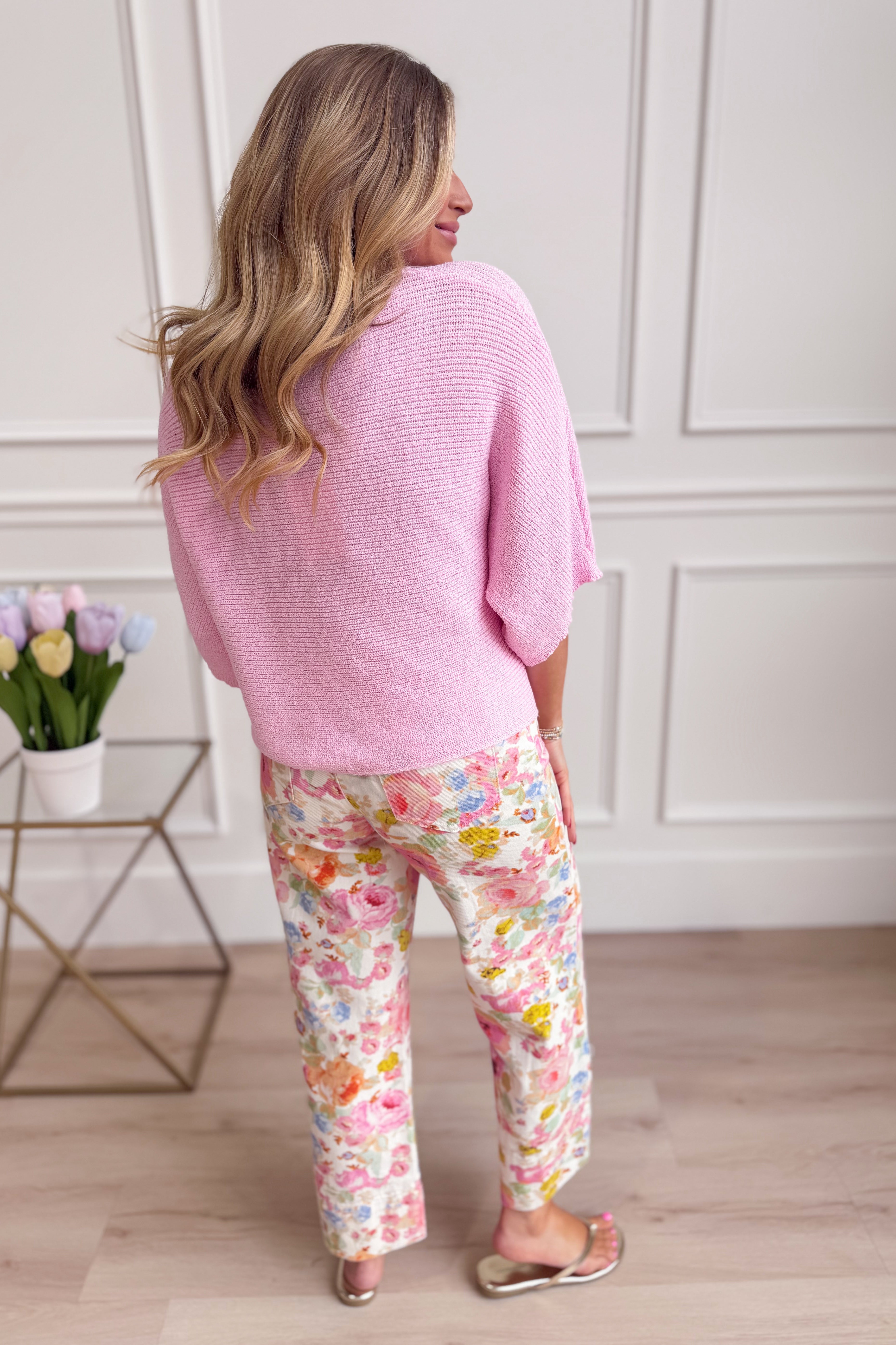 Pink knitted spring top by ENTRO, casual 105 style, featuring a soft, lightweight fabric with a fitted design and textured knit pattern.