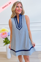 Corinne plaid sleeveless dress by ENTRO, featuring a stylish checkered pattern and a fitted, sleeveless design perfect for dressy occasions.