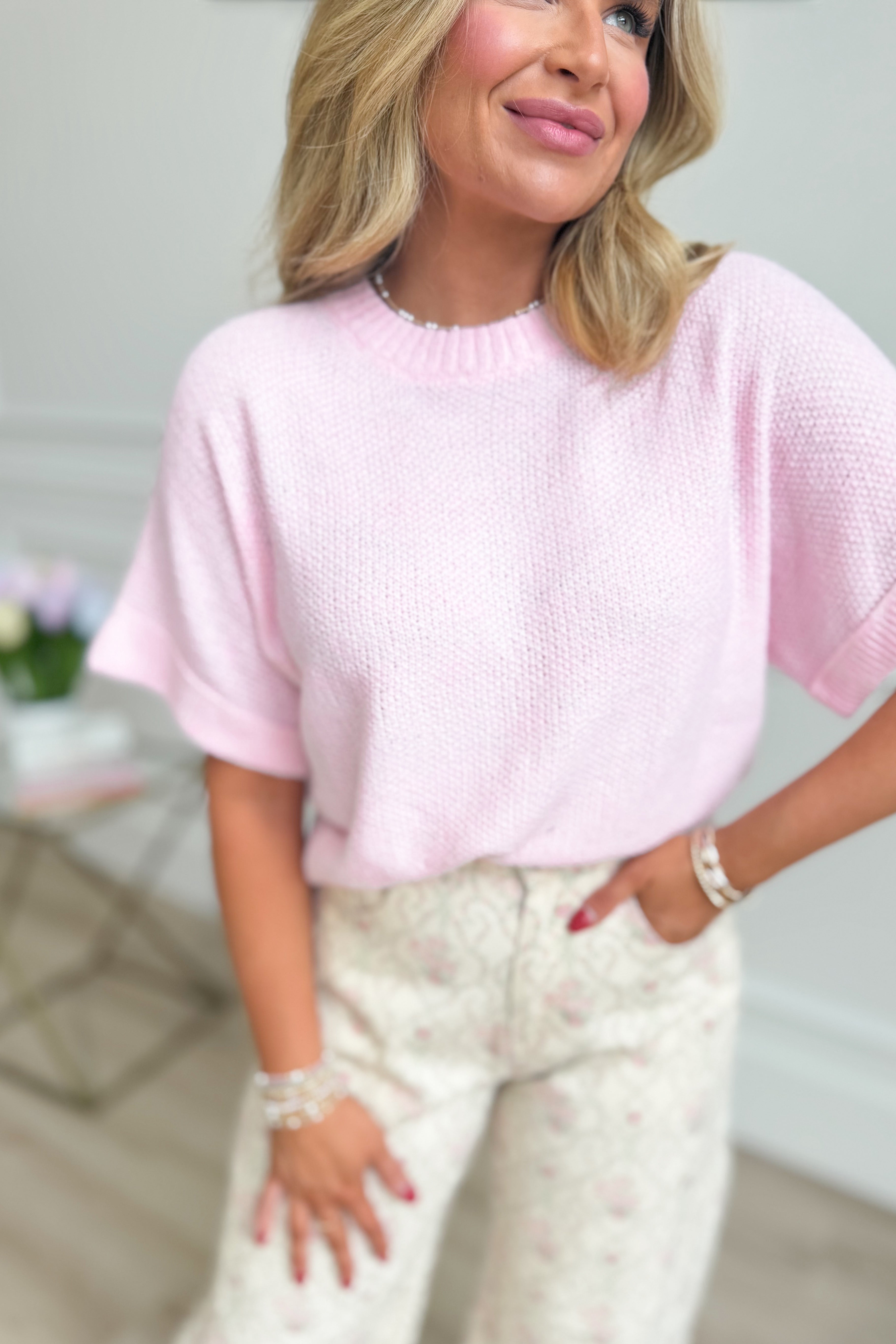 Pink knitted short sleeve top from ENTRO's Brianna Spring collection, featuring a cozy spring sweater design.