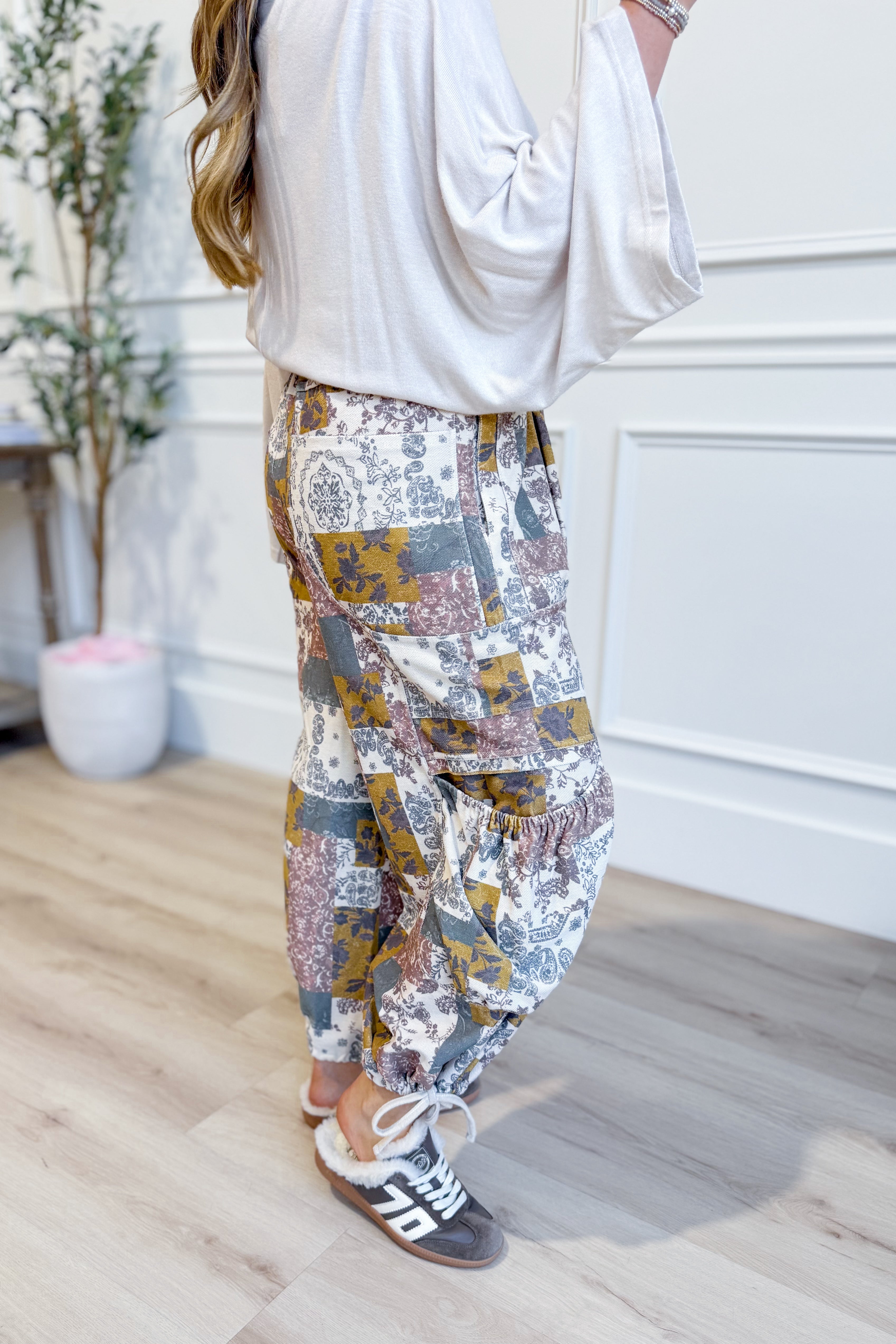 EASEL Cody mixed print patchwork pants, 156 pants style, featuring colorful patchwork fabric and relaxed fit.