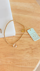 Enewton 2mm Classic Birthstone Bracelet featuring colorful gemstone beads and silver clasp on a white background.
