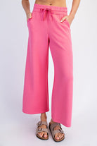 Bright pink Norma cropped wide-leg pants by RAE MODE displayed on a model, showing the relaxed fit and stylish design.