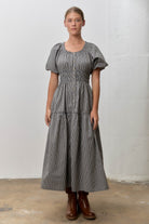 Baevly Tyler Gingham Printed Smocked Waist Dress, a stylish 125 dressy dress with a fitted smocked waist and gingham pattern.