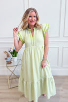 Lacy flutter sleeve solid trim dress by ENTRO, featuring elegant design and flowy fabric, perfect for dressy occasions.