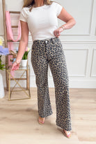 Risen Ed Mid Rise Leopard Wide Leg Pants in animal print, showcasing the stylish fit and bold pattern of these core jeans.