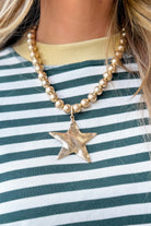 Caroline Hill Melinda Star Pendant beaded necklace featuring a star-shaped pendant on a delicate beaded chain.