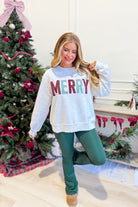 Everleigh Merry multi-colored graphic sweatshirt by TWENTIFOURTH, featuring vibrant design and cozy pullover style.