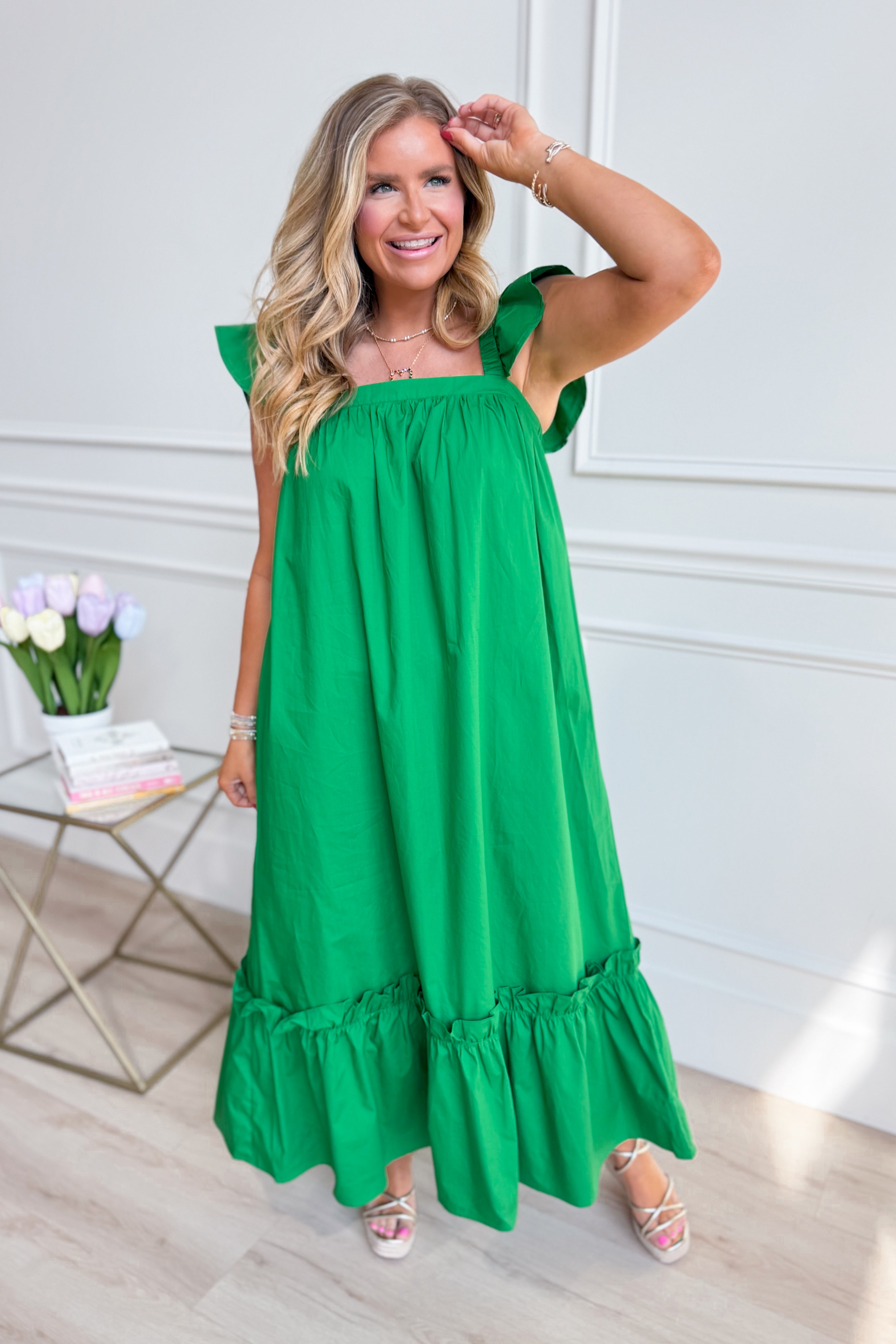 Kelly green Folly flutter sleeve midi dress by TCEC, featuring a flowing silhouette and casual style perfect for warm weather.