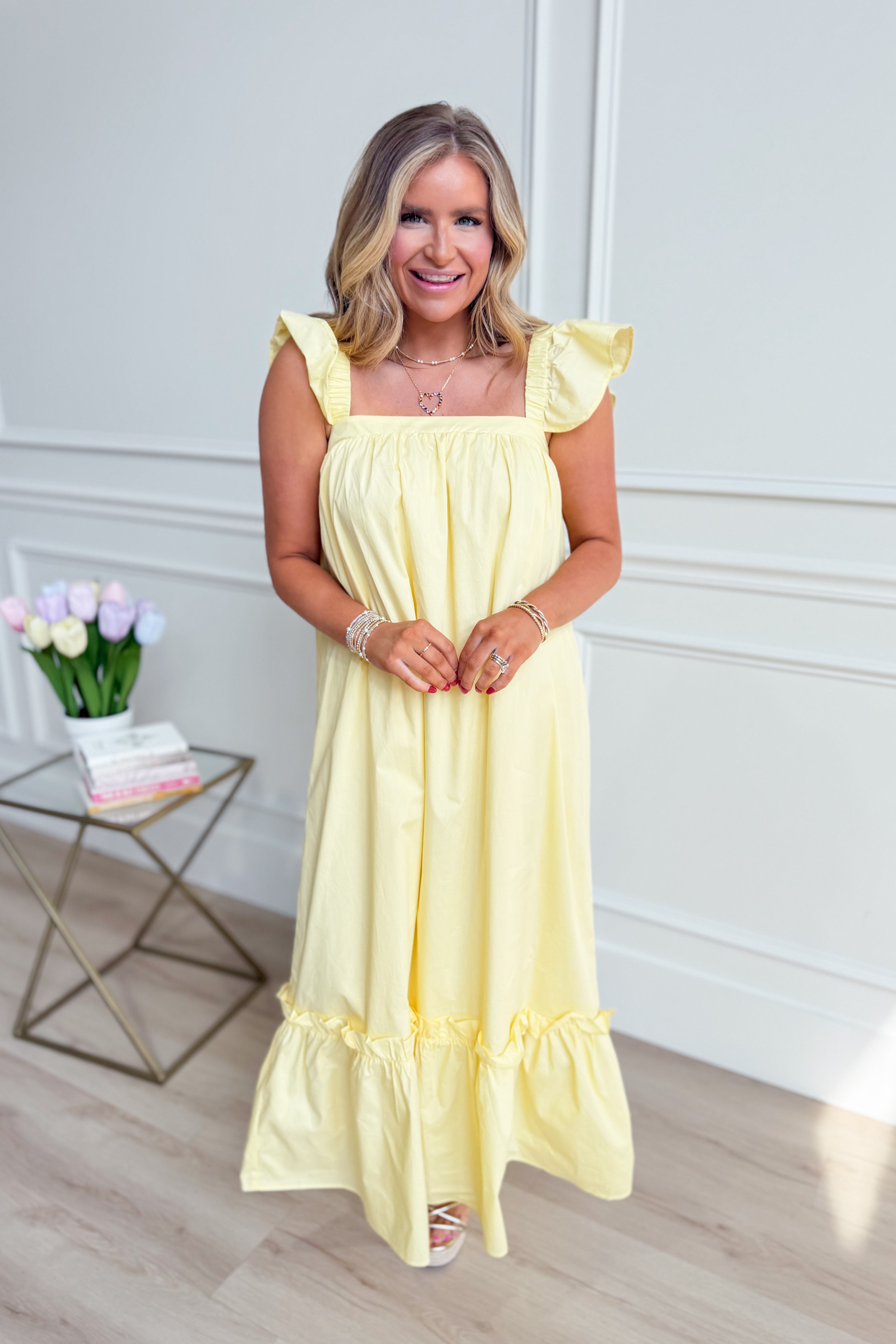 TCEC Folly Butter Flutter Sleeve Midi Dress in a casual style, featuring flutter sleeves and a midi length, displayed on a hanger.