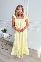 TCEC Folly Butter Flutter Sleeve Midi Dress in a casual style, featuring flutter sleeves and a midi length, displayed on a hanger.