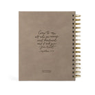 Undated 12-month planner by HOSANNA REVIVAL with a sleek cover, designed for organizing schedules and appointments.