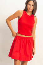 HYFVE Carter red sleeveless ribbed skirt set featuring a fitted crop top and matching high-waisted skirt.