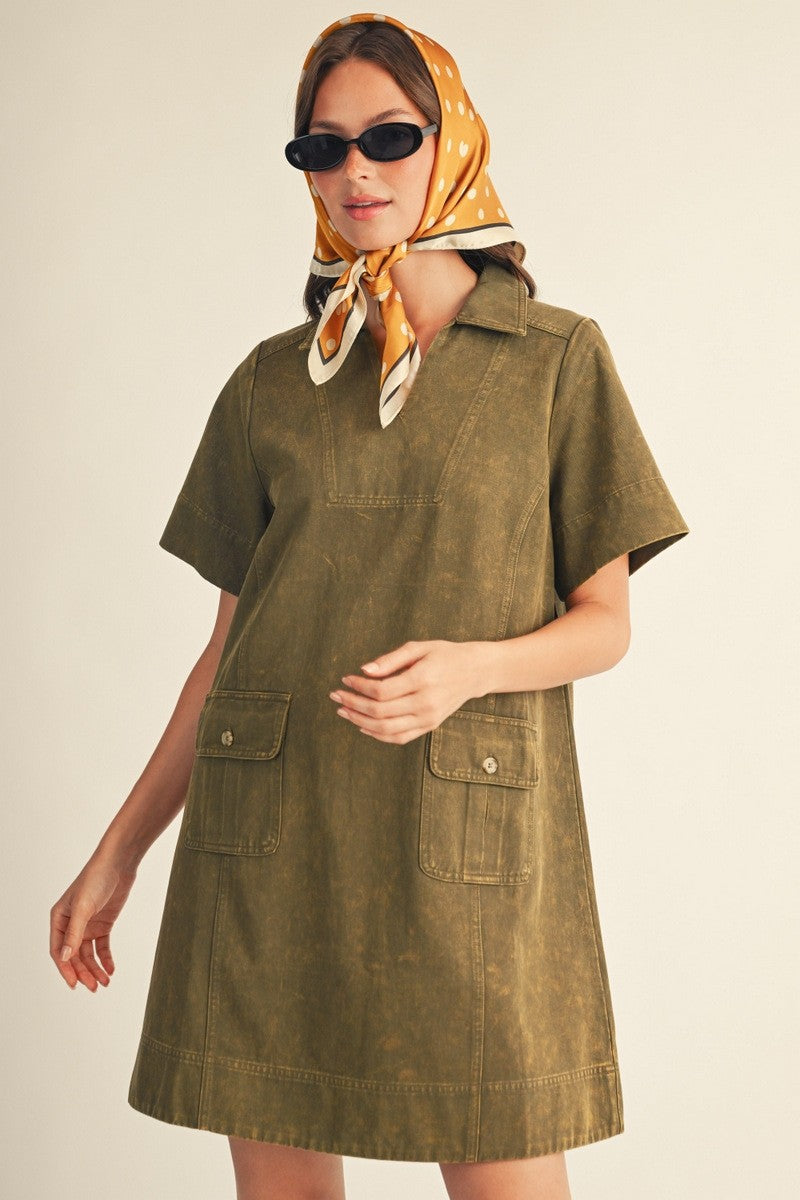 JODIFL London Olive Mineral Wash V-Neck Dress displayed on a hanger, casual style, knee-length, with short sleeves and relaxed fit.